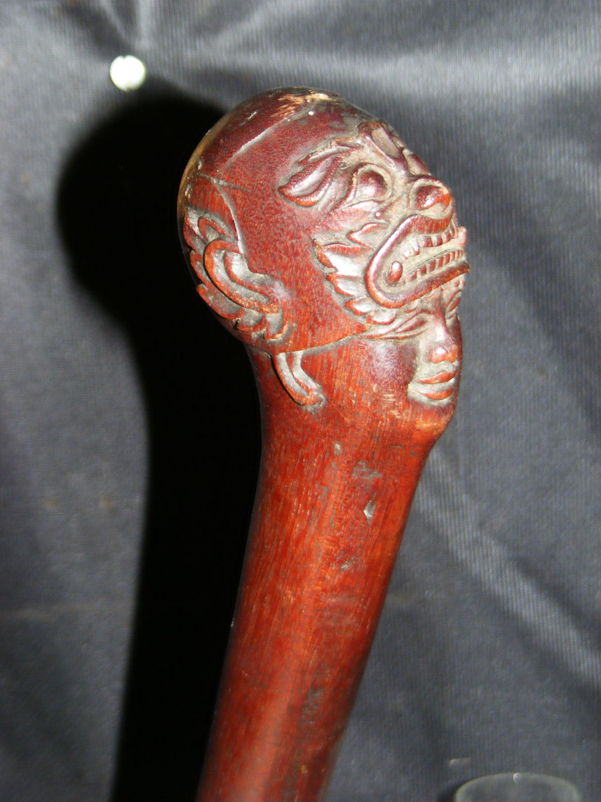 A carved hardwood walking stick