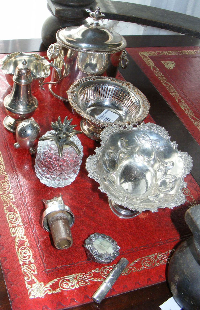 A small silver plated tea canister, pierced dish etc.