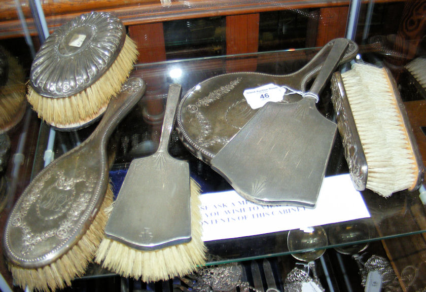 A selection of silver back dressing table mirrors, brushes etc.