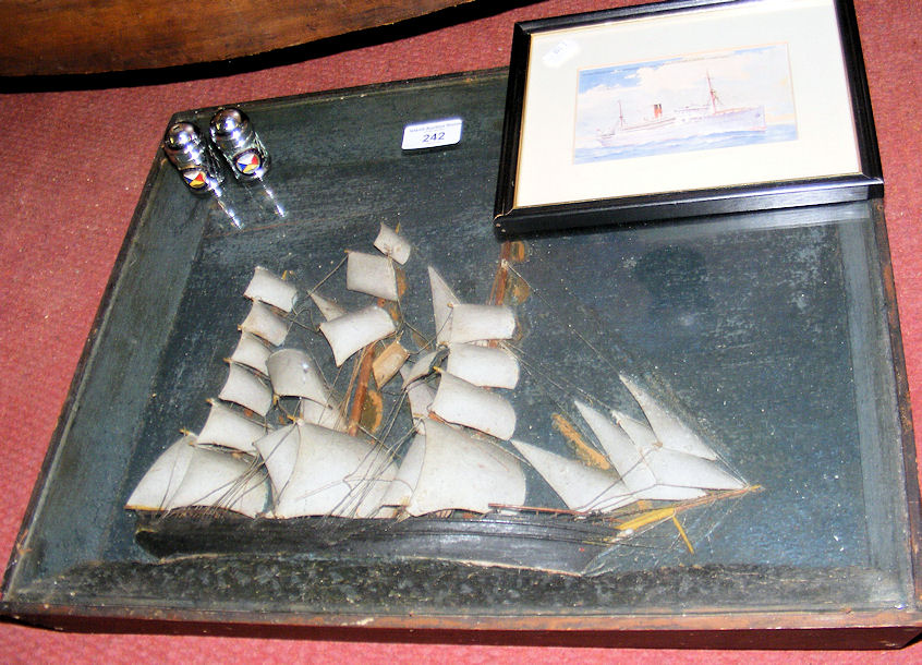 A 48cm x 38cm diorama - three masted schooner, pair of plated salt and peppers with enamel SS “