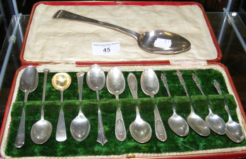 A silver tablespoon, together with other spoons