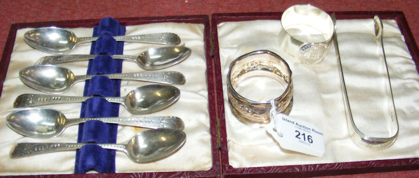 A cased set of six bright cut silver tea spoons, two napkin rings and a pair of sugar tongs