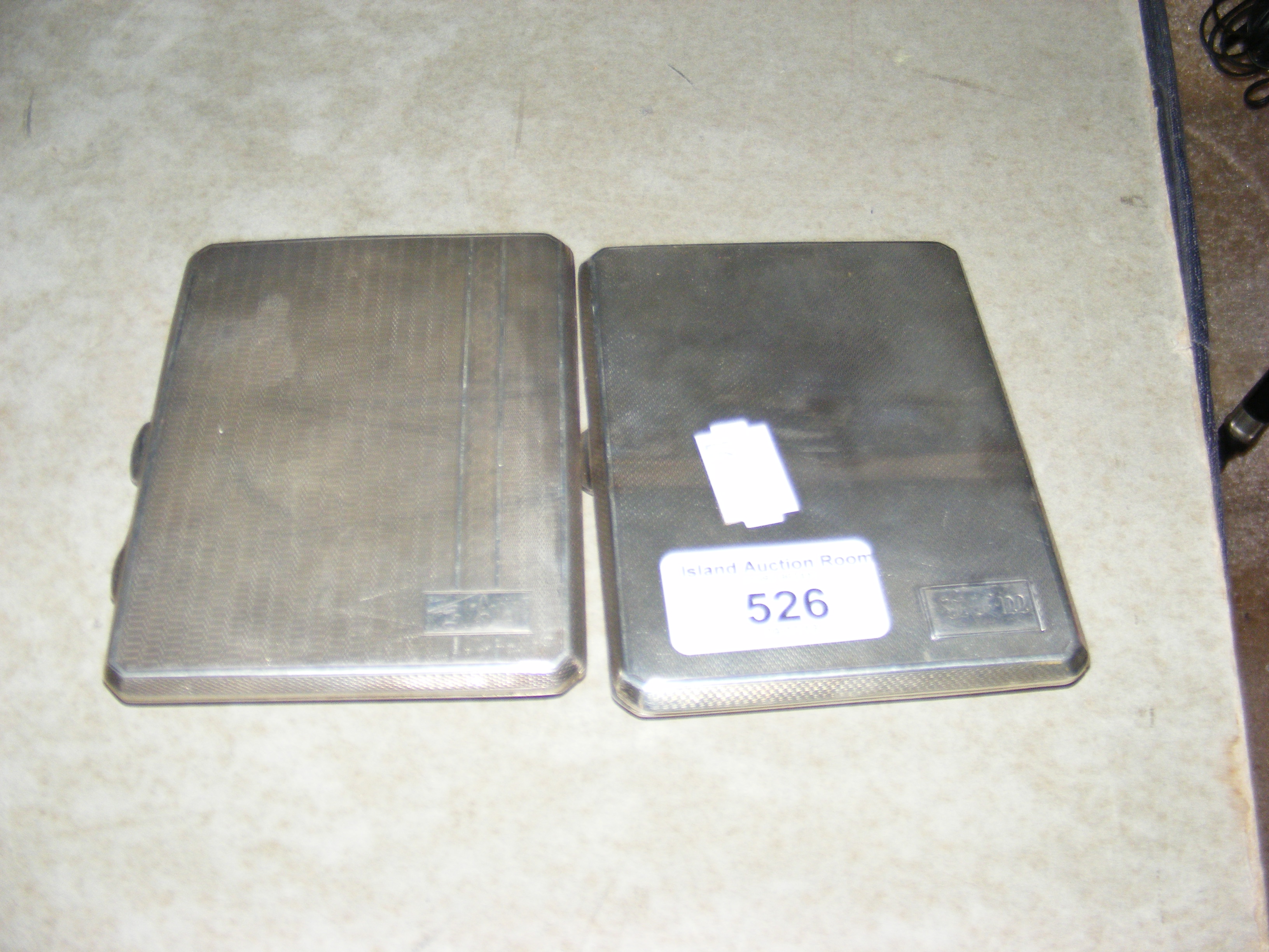 Two engine turned silver cigarette cases