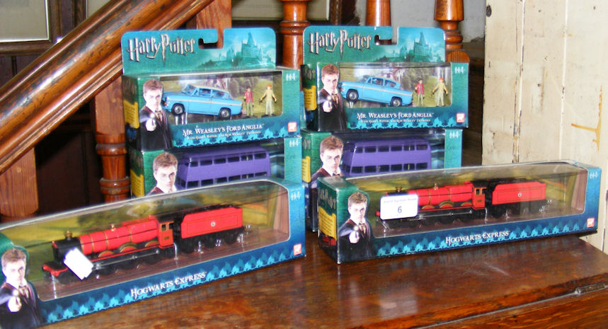 Six boxed die cast “Harry Potter” vehicles/trains