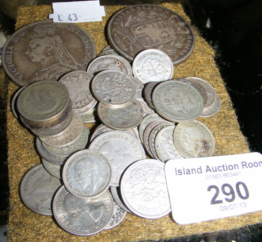 A collection of assorted coinage including silver 3d pieces, Victorian crowns, etc