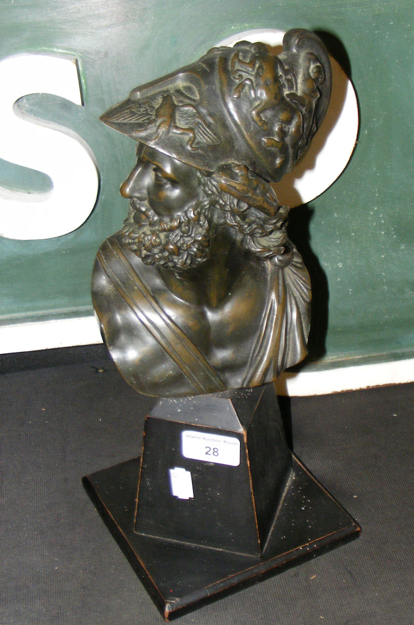 A cast metal bust of Roman soldier on wooden plinth