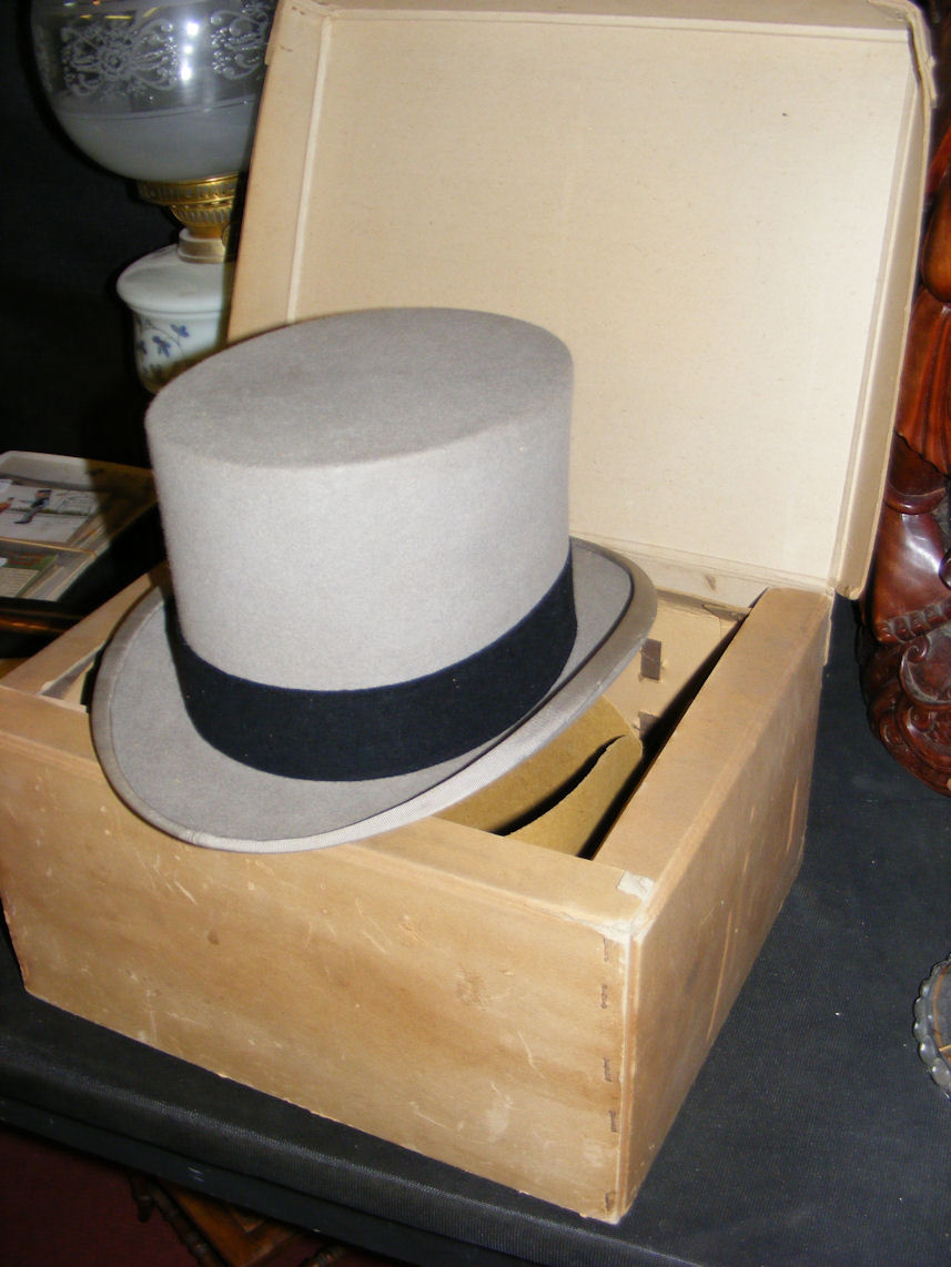 A Moss Bros top hat in original box