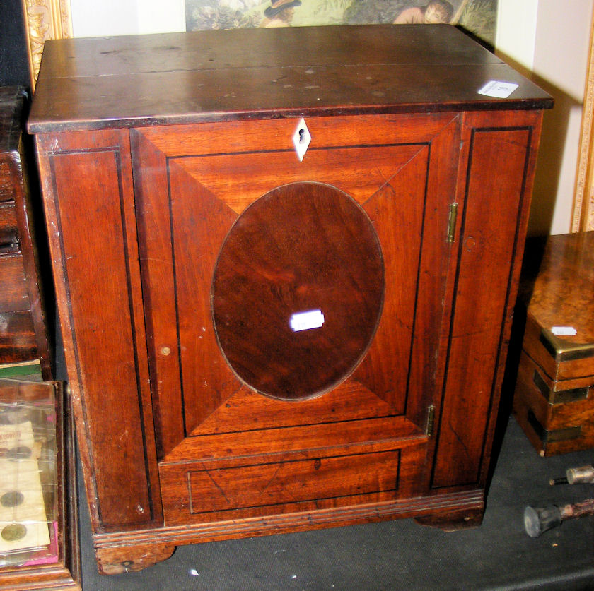 An inlaid mahogany apprentice piece cabinet in the form of wardrobe