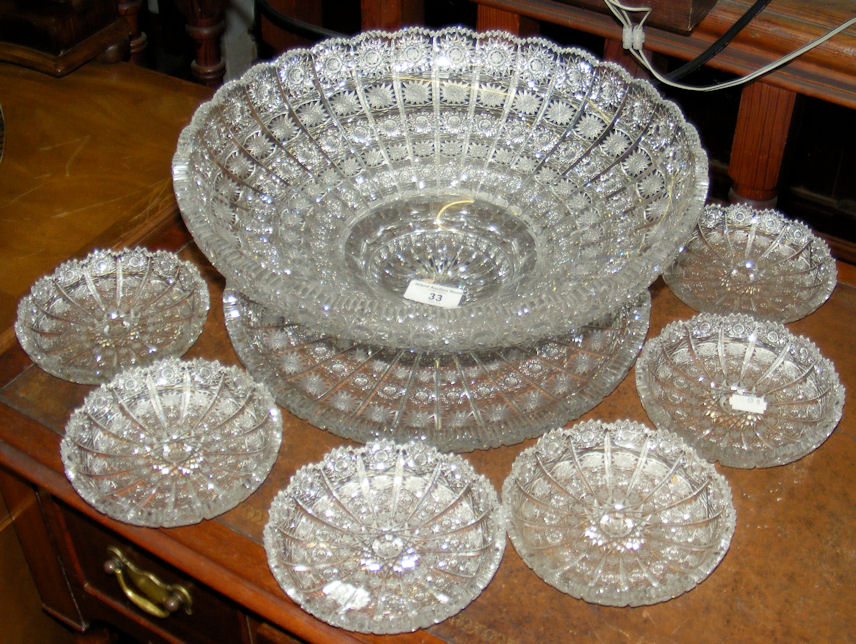 A Bohemian cut crystal fruit bowl and stand with the matching six dishes