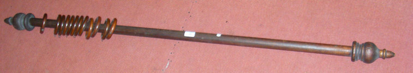 A 132cm Victorian curtain pole with turned finials