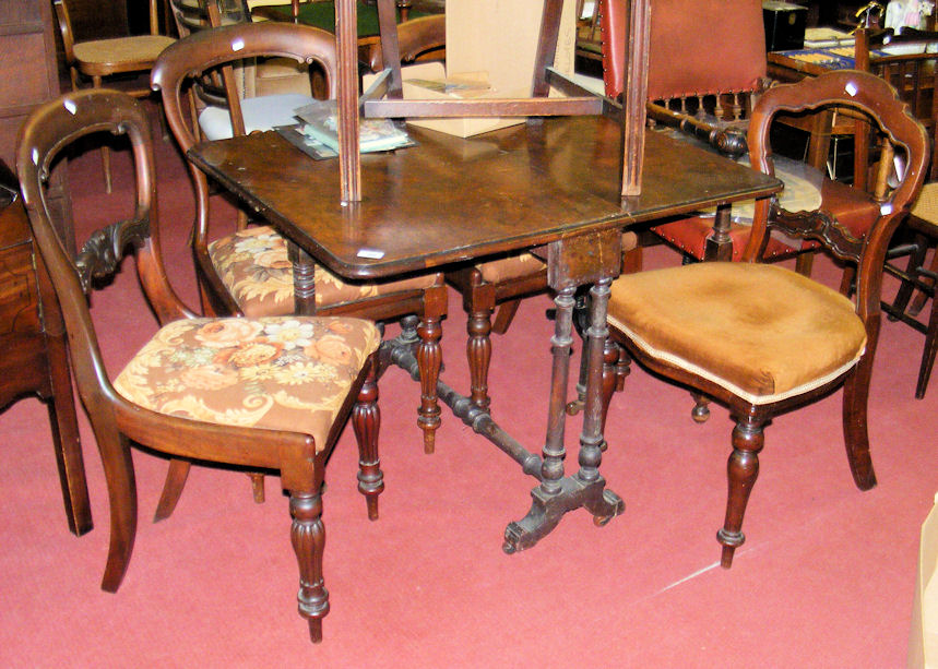 A Victorian walnut Sutherland table on turned supports