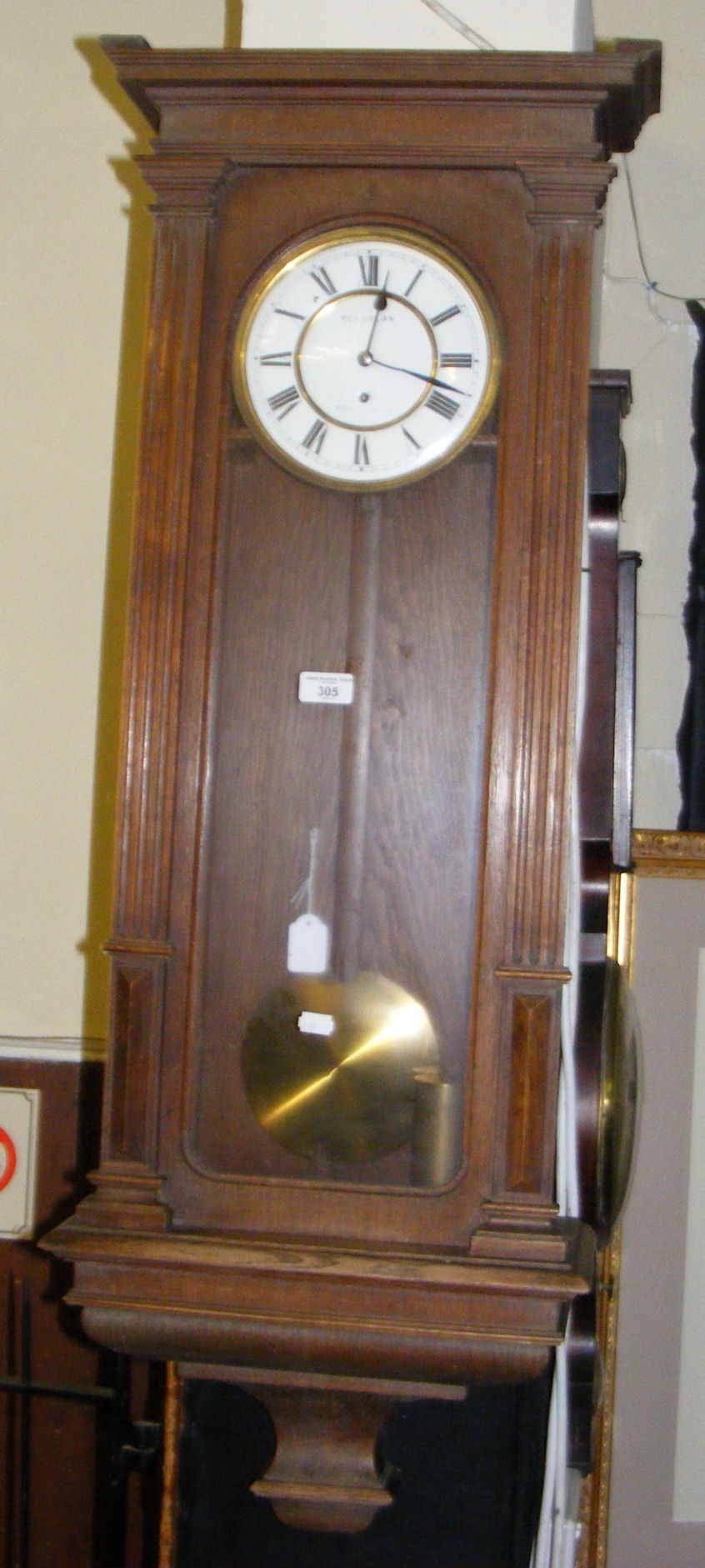 A 19th century Vienna style wall clock, the enamel dial marked Reynolds