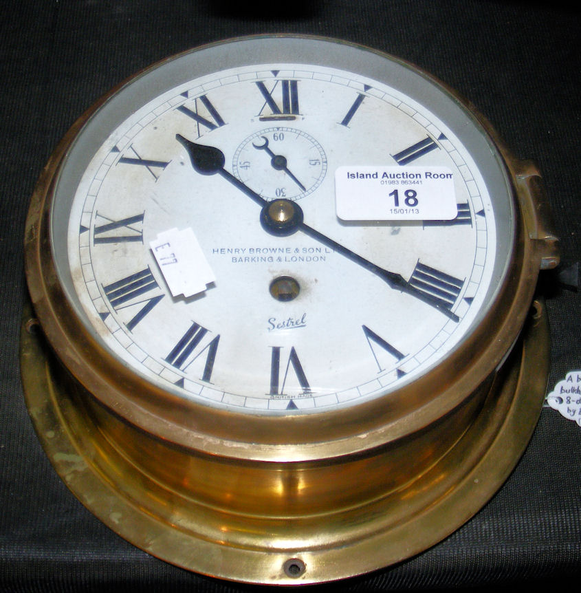 A Sestrel brass cased bulkhead clock with eight day movement by Elliott of London