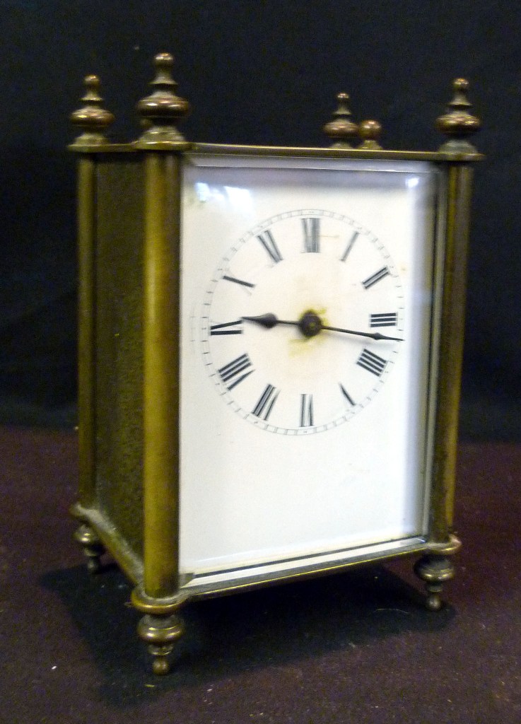 A 19th Century French Brass Cased Carriage Clock, the enamel dial with Roman numerals