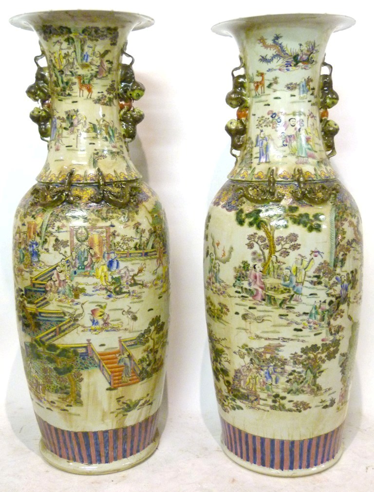 A Pair of Chinese Canton Large Floor Vases, each decorated in polychrome enamels with figures