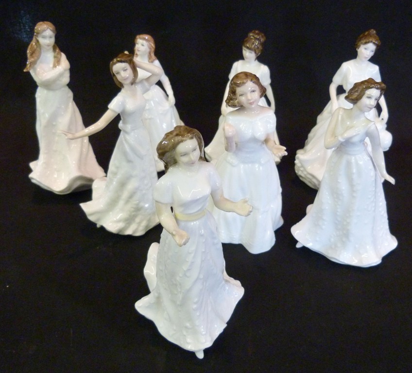 A Collection of Eight Royal Doulton Figurines