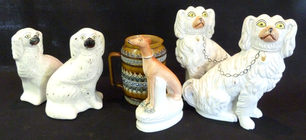 Two Pairs of 19th Century Staffordshire Models of Spaniels, together with a similar Staffordshire