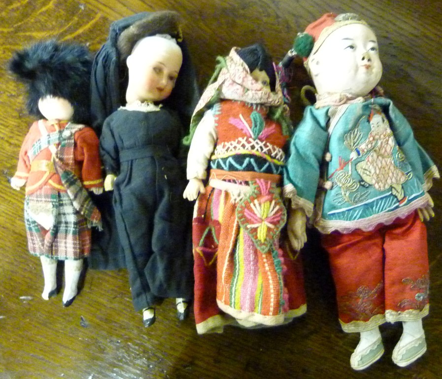 An Armand Marseille Bisque Head Doll (a/f), together with another similar bisque head doll and two