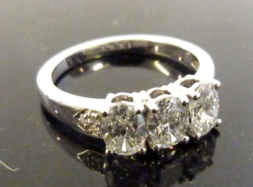 An 18ct White Gold Three Stone Oval Cut Diamond Ring, approx 1.62ct