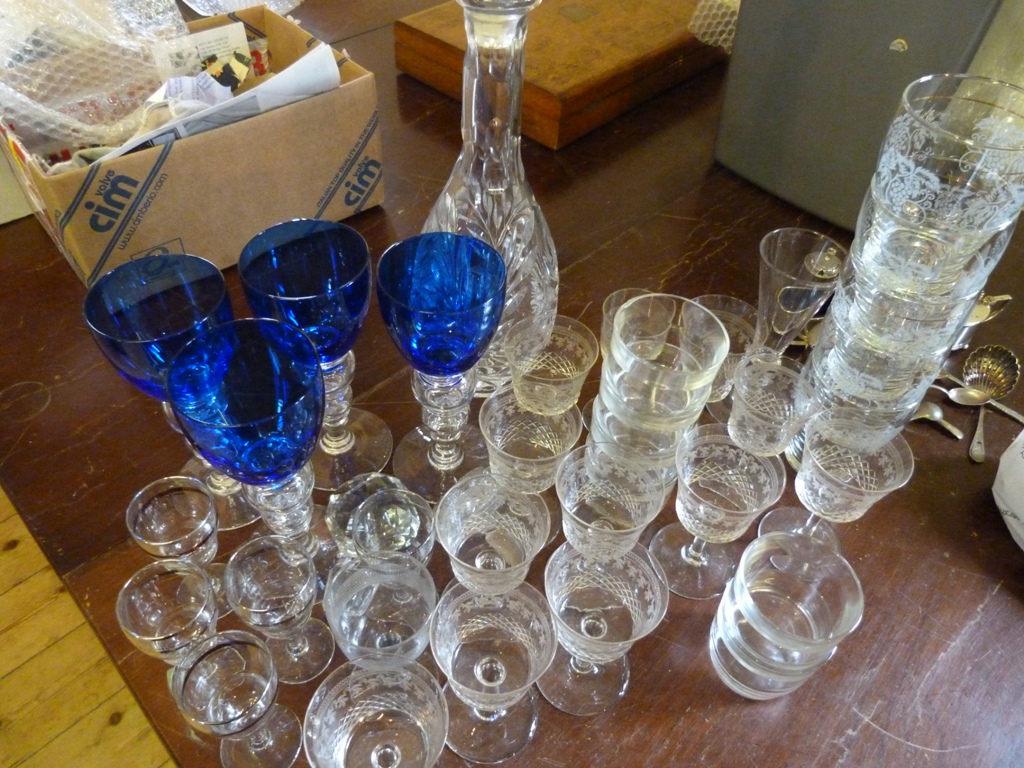 A Collection of Glassware, to include a cut glass decanter with stopper, a set of four blue glass