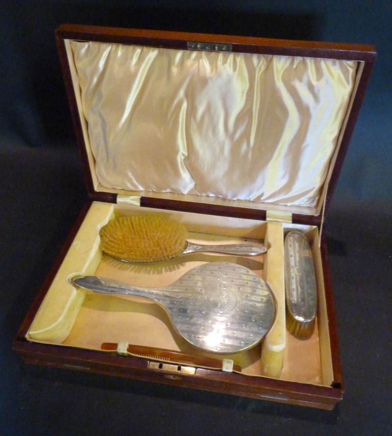 A Birmingham Silver Three-Piece Dressing Table Set, within fitted lined case