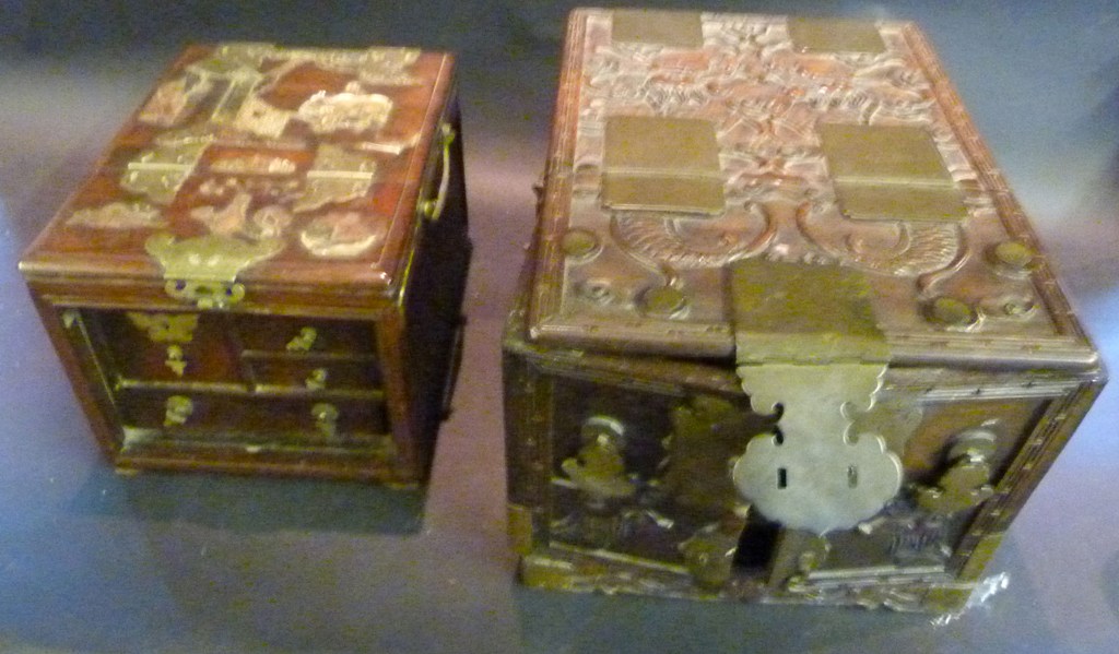 A 19th Century Chinese Hardwood Table Cabinet, the top inset with mother-of-pearl depicting