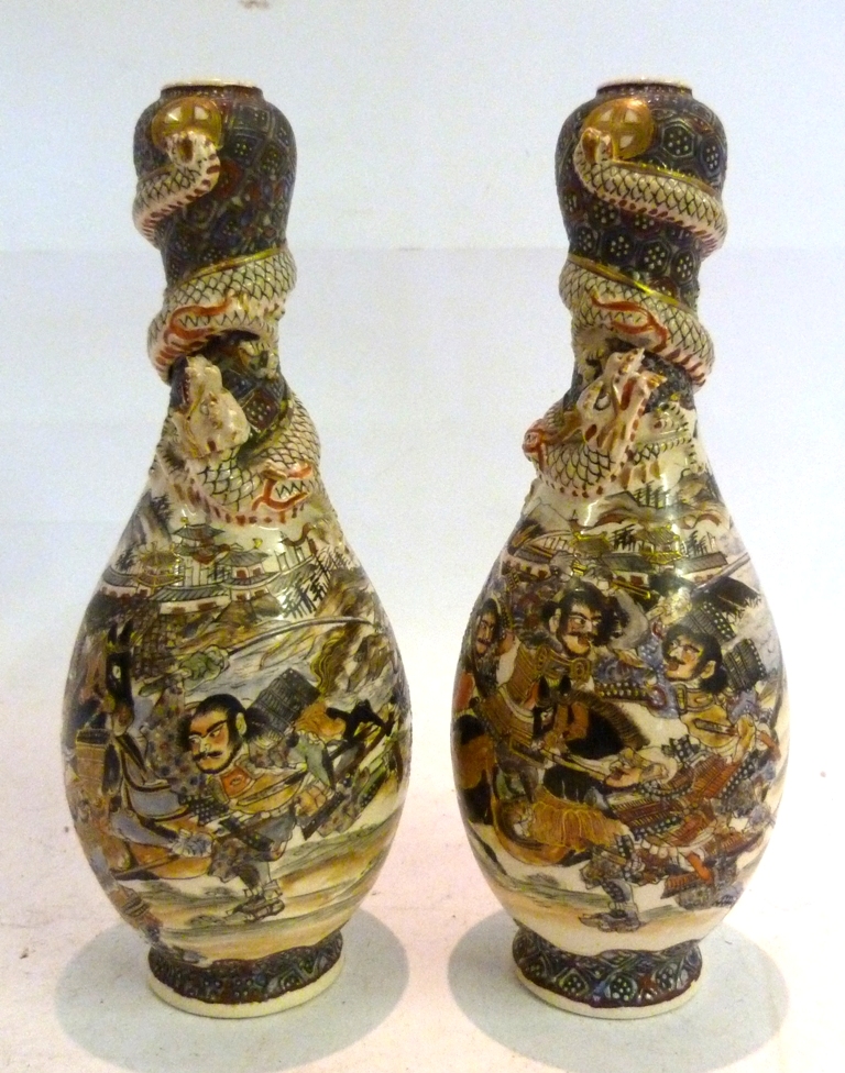 A Pair of Japanese Satsuma Oviform Vases, decorated with figures and serpents, character marks to