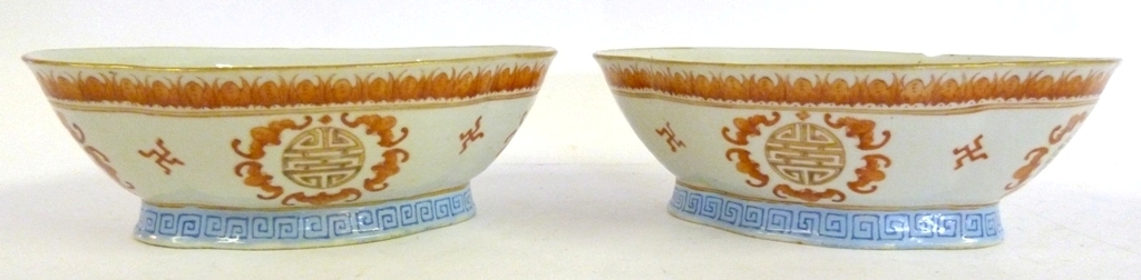 A Pair of Chinese Porcelain Bowls, each decorated in iron red and with red seal marks to base, 22cms