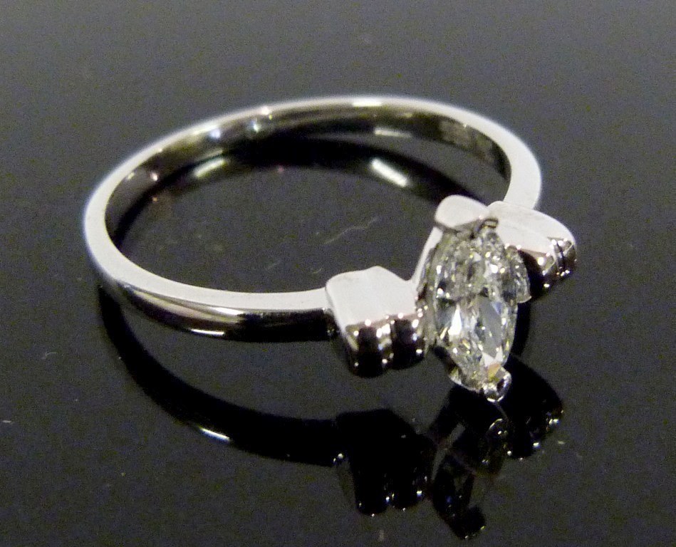 A 14ct.White Gold Solitaire Marquise Cut Diamond Ring, claw set, approximately 0.32ct.