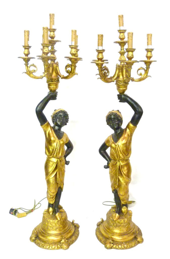 A Pair of Blackamoor Six Branch Candelabra, each with figural columns upon circular bases, 124cms