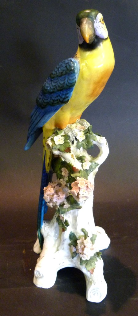 A Sitzendorf Porcelain Model of a Parrot amongst foliage, 32cms high