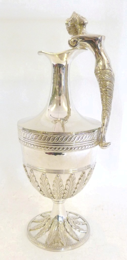 A Large Silver Plated Water Ewer, of bulbous form, with figural handle and circular pedestal base,