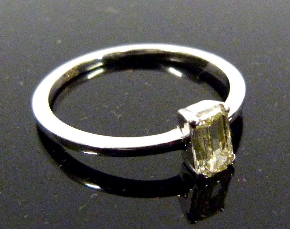 A 14ct.White Gold Solitaire Emerald Cut Diamond Ring, approximately 0.44ct.