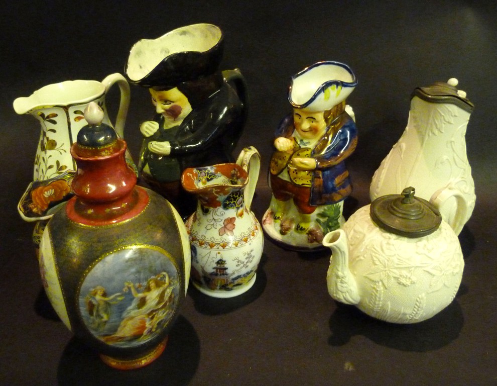 A Large Staffordshire Character Jug, together with a collection of other items to include jugs and