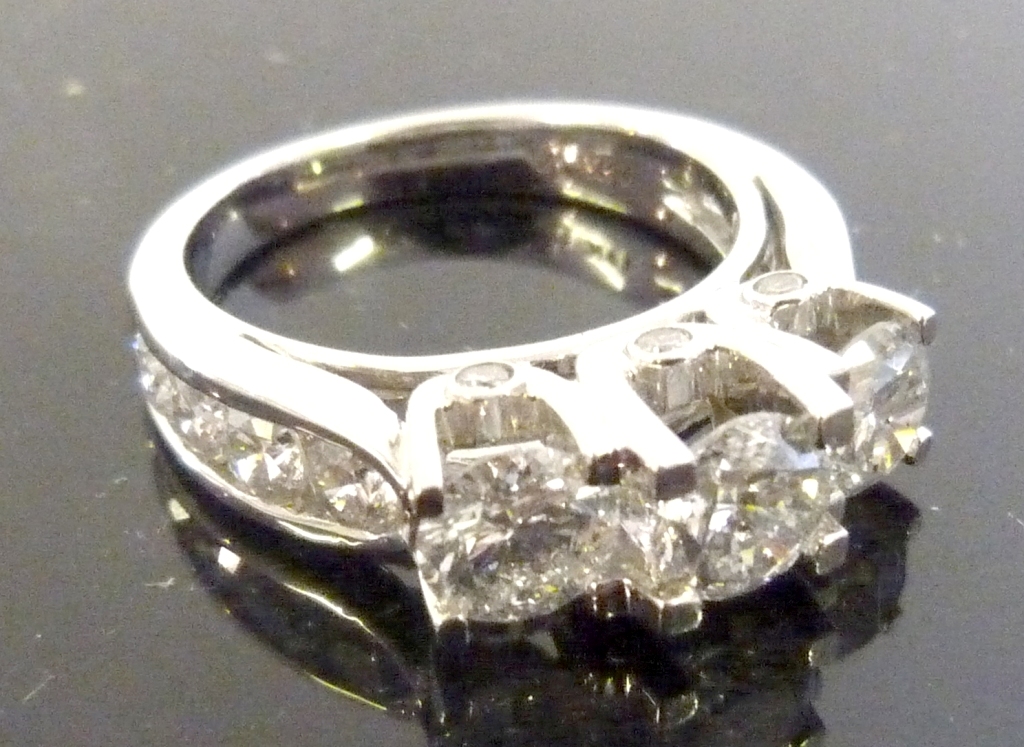 A 14ct White Gold Three Stone Diamond Ring, with diamond shoulders, approx 2.75ct