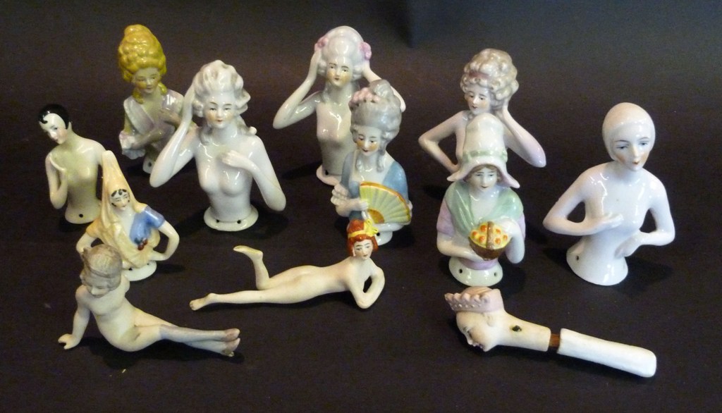 A Collection of Porcelain Pin Cushion Half Dolls, together with three bisque figures