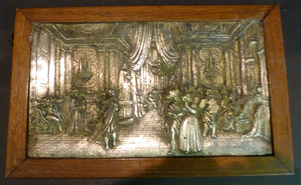 An Early 20th Century Electro-Plated Plaque, decorated in relief with figures within an interior