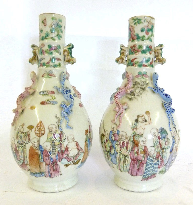 A Pair of 19th Century Canton Oviform Vases, decorated in polychrome enamels with figures and in