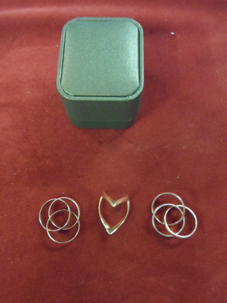 Three ring yellow-gold - one unmarked but test as 18ct, another tests as 14ct, third as 9ct.