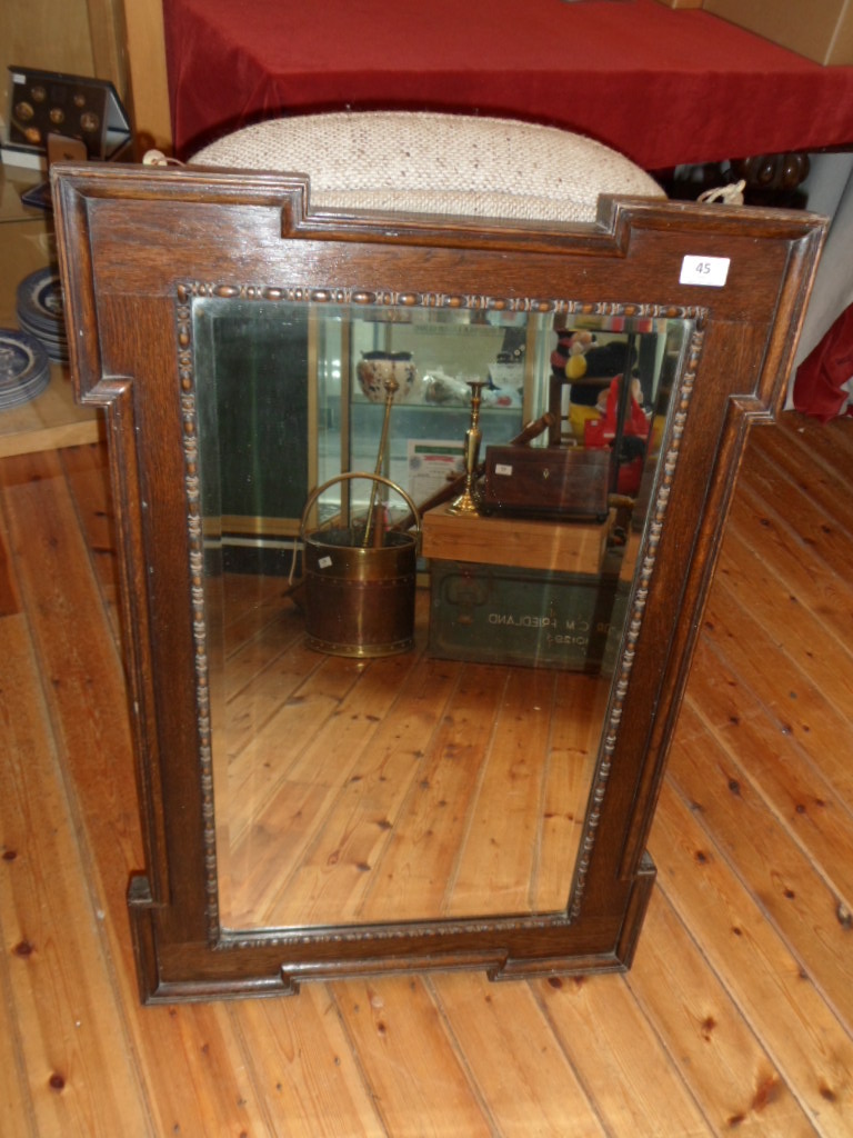 A framed Edwardian mirror 15" x 26".