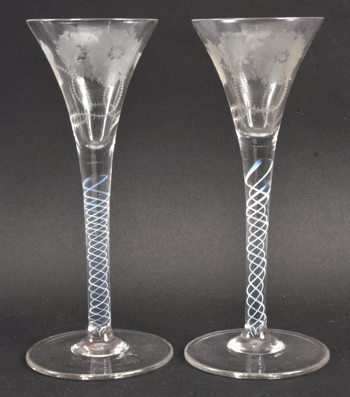 A MATCHING PAIR OF FLUTED WINE GLASSES.