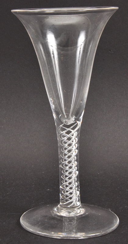 A GEORGIAN FLUTED WINE GLASS with air twist stem. 7ins high.