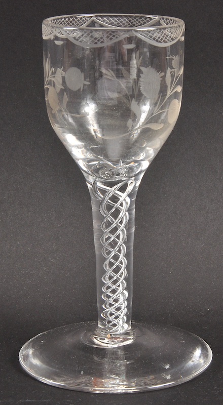 A GEORGIAN WINE GLASS, the bowl engraved with roses, with air twist stem. 6ins high.