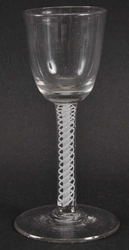 A GEORGIAN WINE GLASS with plain bowl and white opaque air twist stem. 5.25ins high.