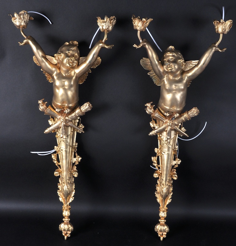 A PAIR OF LOUIS XVITH STYLE ORMOLU WALL LIGHTS with cupids. 28ins long.