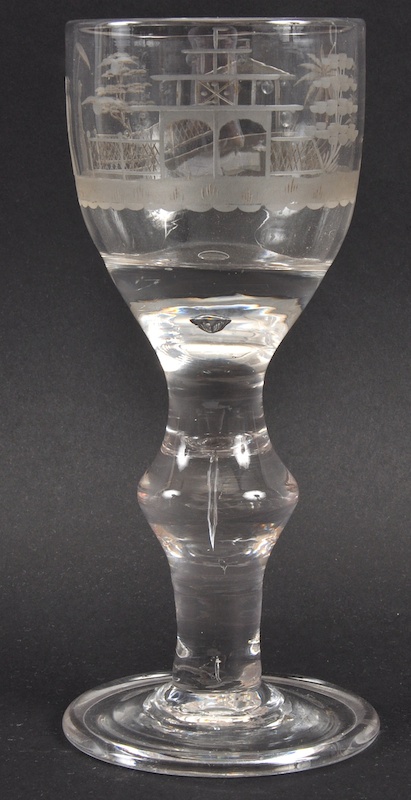 A HEAVY GEORGIAN WINE GLASS, the bowl engraved with a Chinese design with a knop stem, with tier