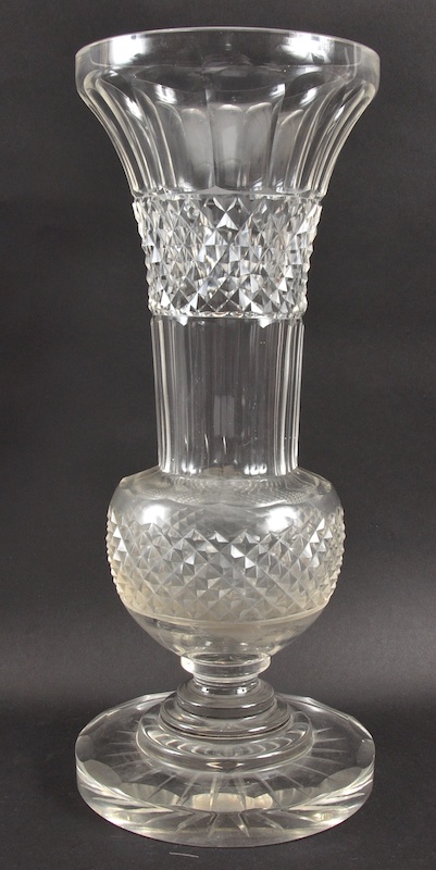 A TALL THISTLE SHAPED SLICE CUT FLOWER VASE on a heavy circular base. 17.5ins high.