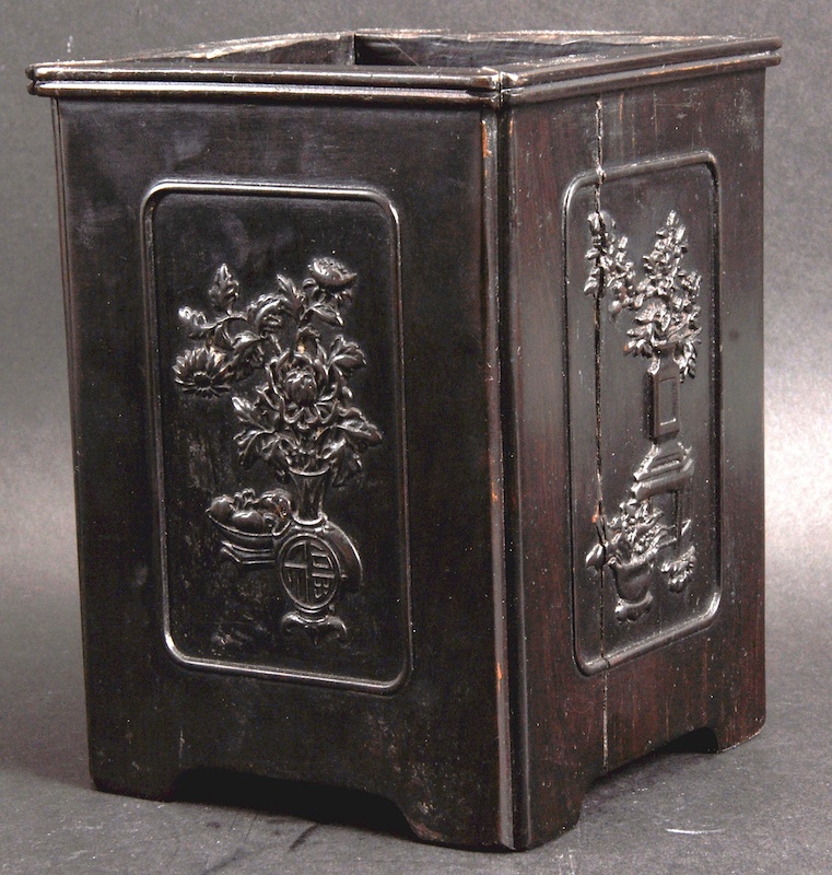 A CHINESE QING DYNASTY CARVED ZITAN WOOD BRUSH POT of square form, carved with panels of flowers and