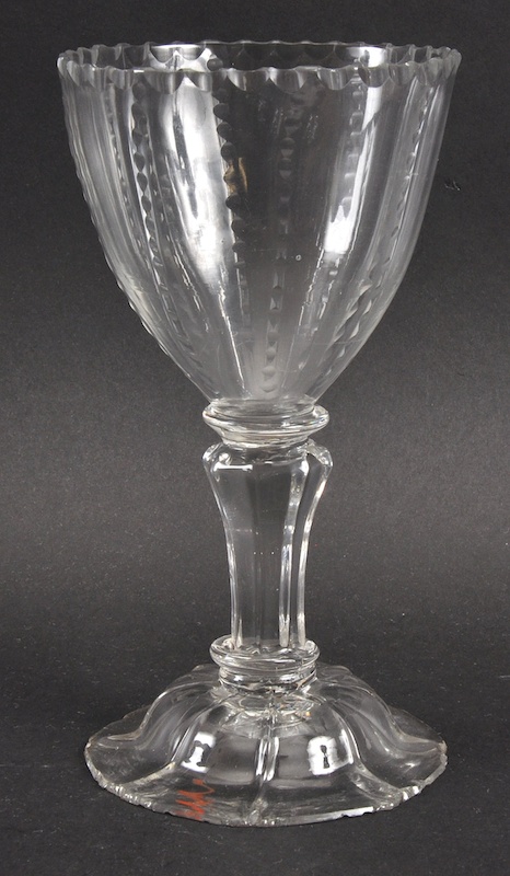 A GEORGIAN GOBLET, PROBABLY DUTCH, with fluted stem. 7ins high.