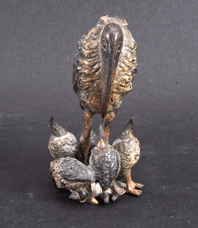 AN AUSTRIAN PAINTED COLD CAST PELICAN WITH CHICKS. 3.5ins high.